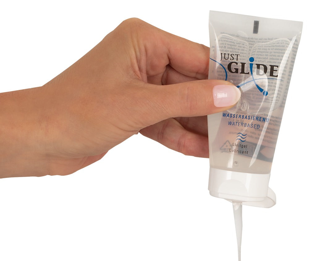 Just Glide water-based lubricant showing smooth gel texture and easy-squeeze tube design